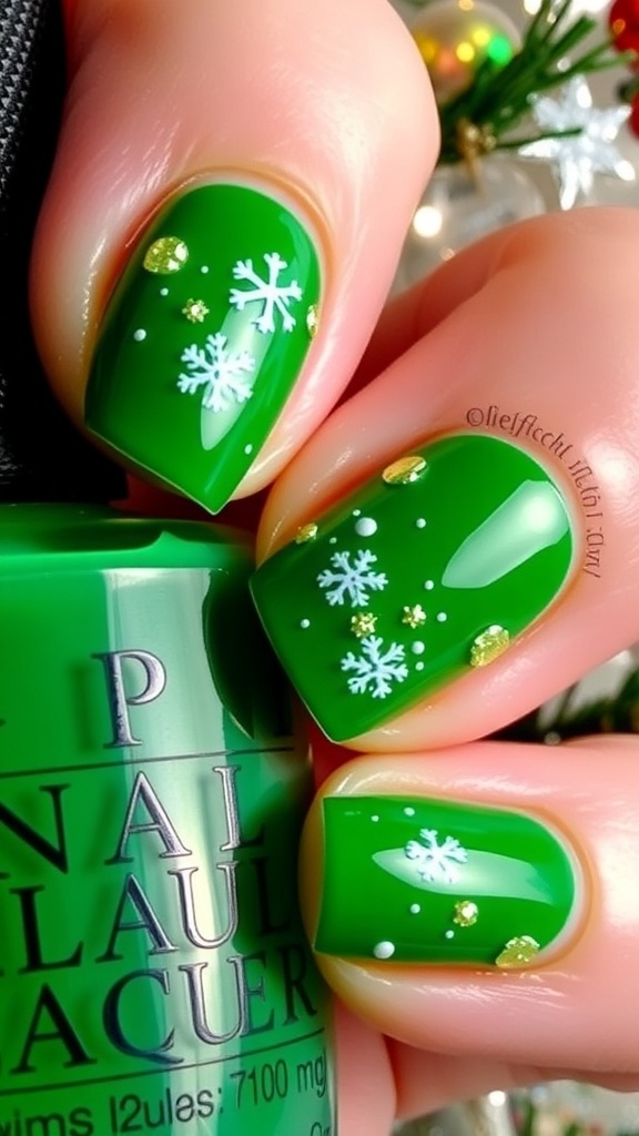 Close-up of green Christmas nails with snowflake designs and glitter accents.